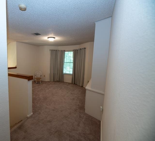 1111 Bayshore St, Allen, TX 75002 - carpeted empty room featuring a textured ceiling and a smoke detector