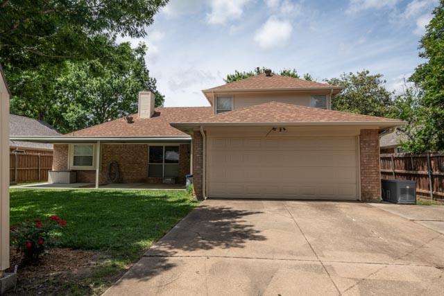 1111 Bayshore St, Allen, TX 75002 - view of front facade featuring brick siding, a chimney, concrete driveway, an attached garage, and central air condition unit