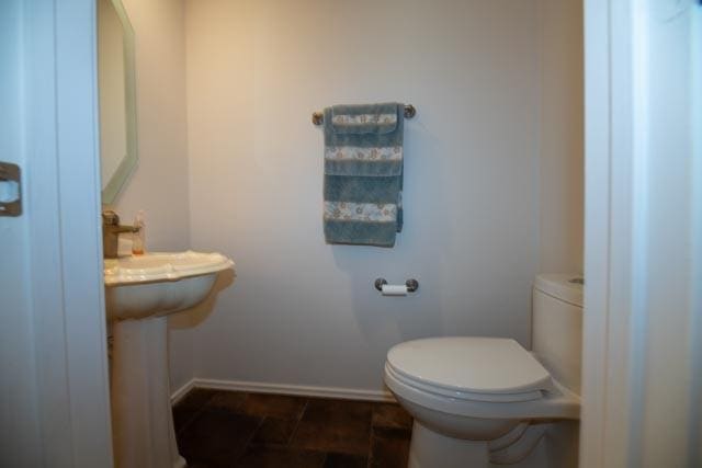 1111 Bayshore St, Allen, TX 75002 - bathroom with baseboards and toilet