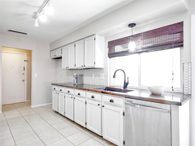 3609 Marwick Dr, Plano, TX 75075 - kitchen featuring dishwasher, a sink, light tile patterned floors, white cabinets, and tasteful backsplash