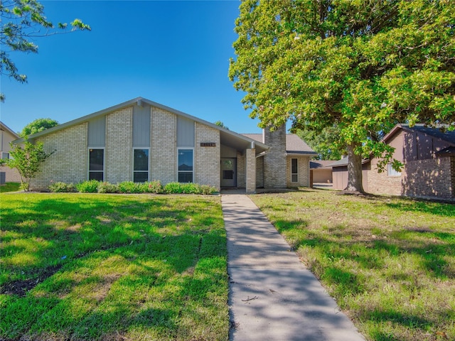 3609 Marwick Dr, Plano, TX 75075 - mid-century modern home featuring brick siding and a front lawn