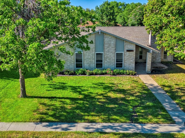 3609 Marwick Dr, Plano, TX 75075 - mid-century home with a front yard and brick siding