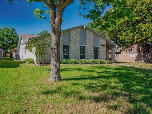 3609 Marwick Dr, Plano, TX 75075 - view of front of house featuring cooling unit, a front yard, and brick siding