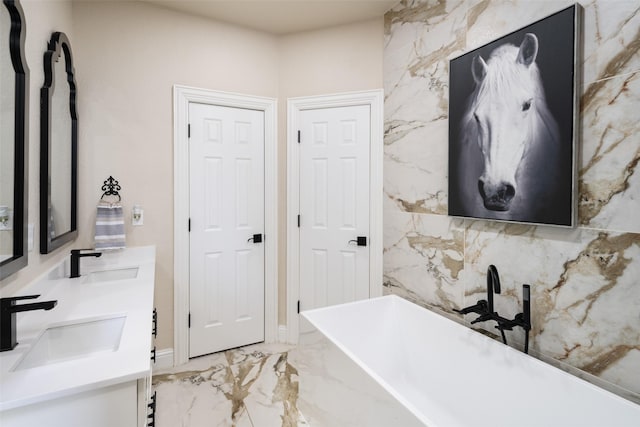 9390 Lakeridge Dr, Princeton, TX 75407 - bathroom featuring double vanity, a soaking tub, and marble tiled flooring