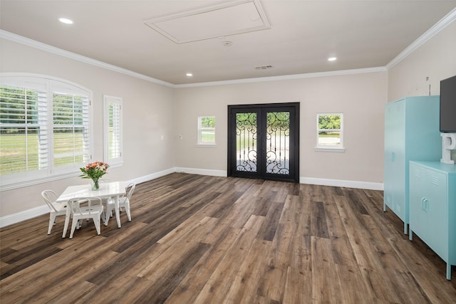 9390 Lakeridge Dr, Princeton, TX 75407 - entrance foyer with french doors, plenty of natural light, dark wood-style floors, crown molding, and recessed lighting