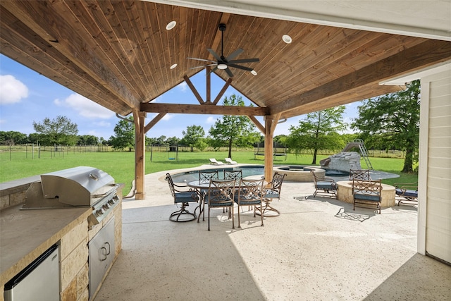 9390 Lakeridge Dr, Princeton, TX 75407 - view of patio featuring an outdoor fire pit, a gazebo, ceiling fan, and outdoor dining space
