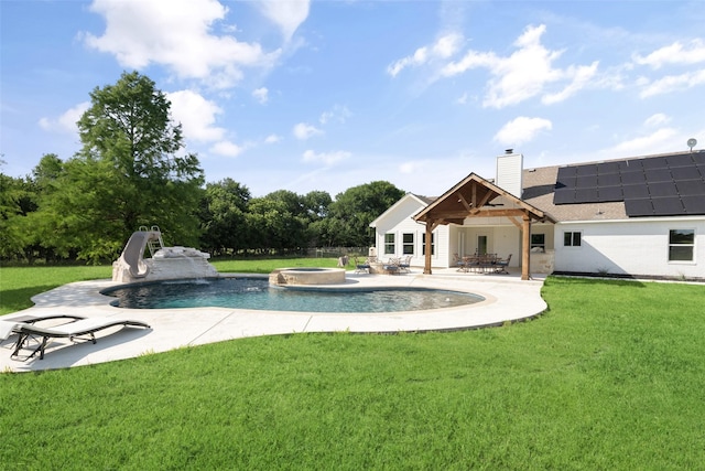 9390 Lakeridge Dr, Princeton, TX 75407 - view of pool featuring a water slide, a lawn, a patio area, and a pool with connected hot tub