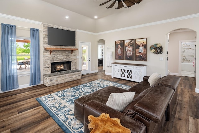 9390 Lakeridge Dr, Princeton, TX 75407 - living room with arched walkways, a ceiling fan, baseboards, a stone fireplace, and recessed lighting