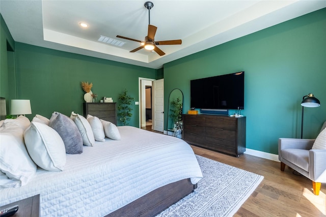 2402 Cornerstone Dr, Mansfield, TX 76063 - bedroom featuring wood finished floors, baseboards, a raised ceiling, a ceiling fan, and recessed lighting