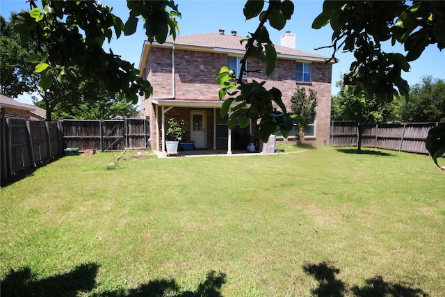3231 Torio, Grand Prairie, TX 75054 - back of house with a chimney, brick siding, and a patio
