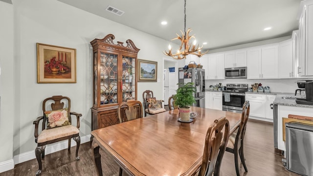 113 Myers Ave, Cleburne, TX 76033 - dining area with a chandelier, dark wood-style floors, baseboards, and recessed lighting