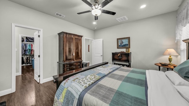 113 Myers Ave, Cleburne, TX 76033 - bedroom featuring baseboards, dark wood-style floors, a spacious closet, recessed lighting, and a ceiling fan