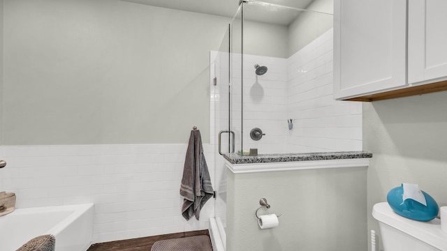 113 Myers Ave, Cleburne, TX 76033 - bathroom featuring toilet, a shower stall, and a bath