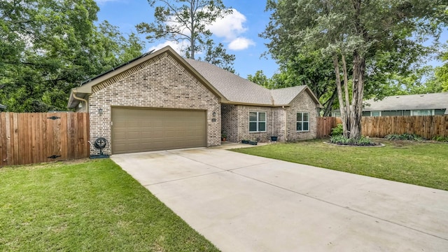 113 Myers Ave, Cleburne, TX 76033 - view of front of house with brick siding, an attached garage, concrete driveway, and a shingled roof