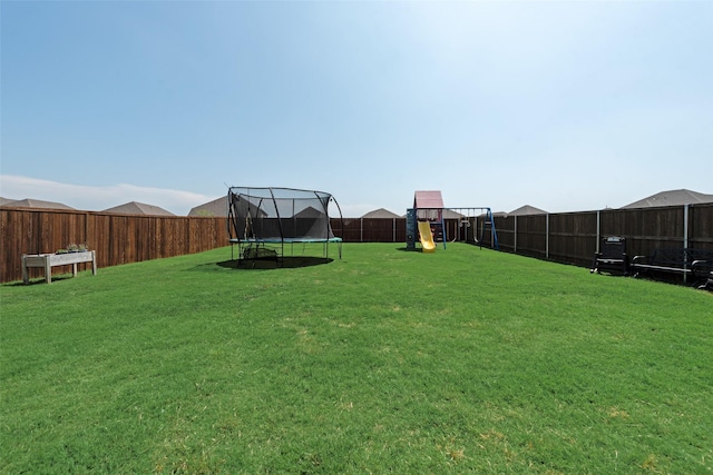 14024 Callisto Way, Haslet, TX 76052 - view of yard with a trampoline and a playground