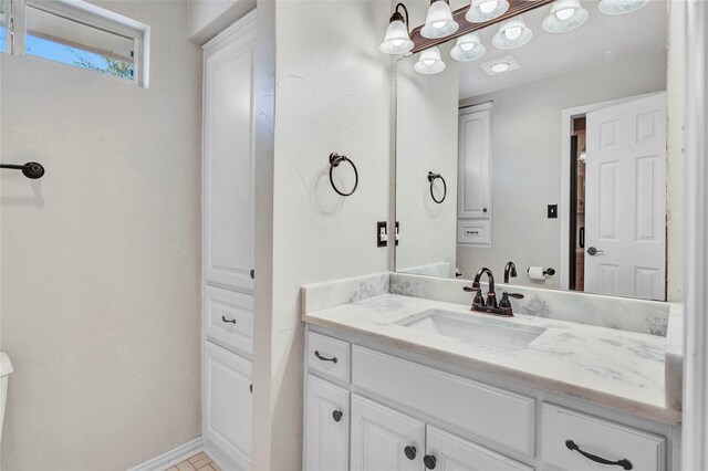 15741 Big Horn Trl, Frisco, TX 75035 - bathroom featuring vanity and baseboards