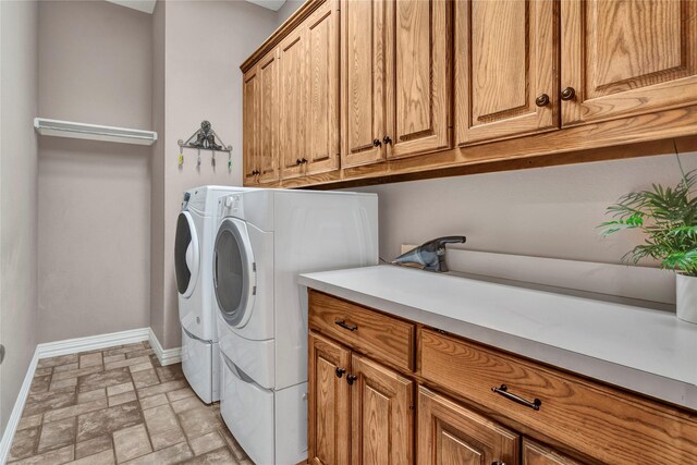 15741 Big Horn Trl, Frisco, TX 75035 - laundry area with cabinet space, baseboards, and washing machine and clothes dryer