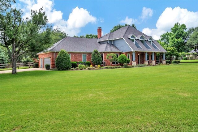 15741 Big Horn Trl, Frisco, TX 75035 - craftsman inspired home featuring a chimney, an attached garage, brick siding, and concrete driveway