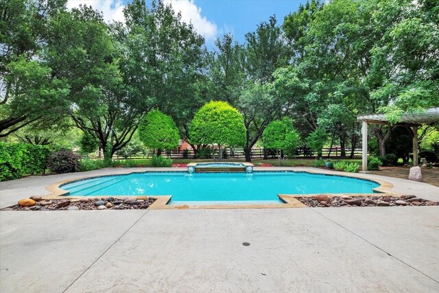 15741 Big Horn Trl, Frisco, TX 75035 - outdoor pool featuring a jacuzzi, a patio, and view of scattered trees