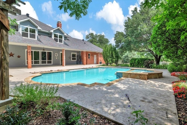 15741 Big Horn Trl, Frisco, TX 75035 - view of pool featuring a patio and a pool with connected hot tub