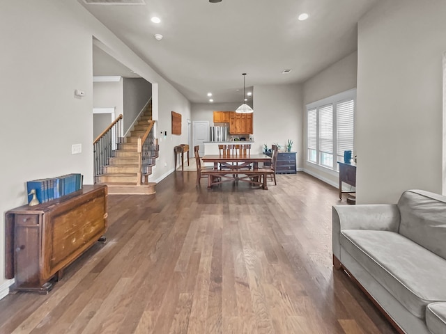 503 S 5th St, Sanger, TX 76266 - dining area with dark wood-type flooring, baseboards, stairs, and recessed lighting