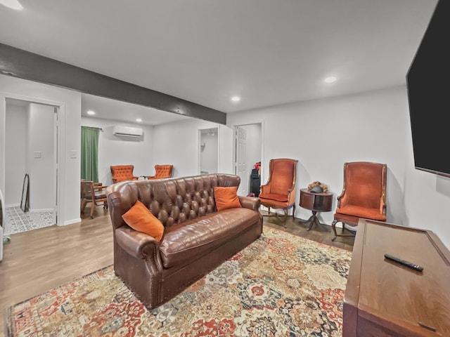 503 S 5th St, Sanger, TX 76266 - living room featuring a wall unit AC, wood finished floors, and recessed lighting