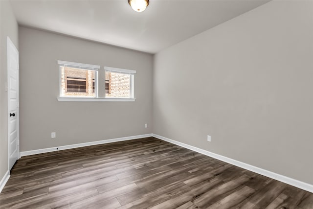 106 Camelia St, Garland, TX 75043 - unfurnished room with dark wood-style flooring and baseboards