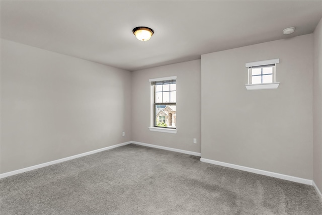 106 Camelia St, Garland, TX 75043 - carpeted spare room with baseboards and a smoke detector