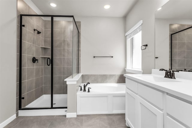 106 Camelia St, Garland, TX 75043 - full bath featuring a garden tub, a stall shower, vanity, tile patterned flooring, and recessed lighting