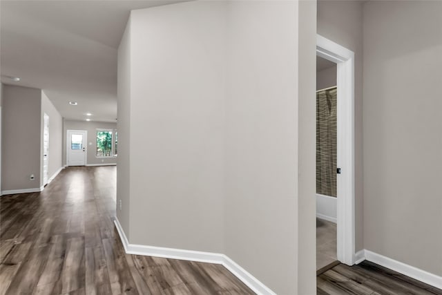 106 Camelia St, Garland, TX 75043 - hall featuring dark wood-style flooring, baseboards, and recessed lighting