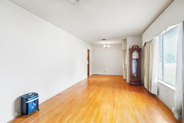 520 Circleview Dr S, Hurst, TX 76054 - empty room with a chandelier and light wood-style floors