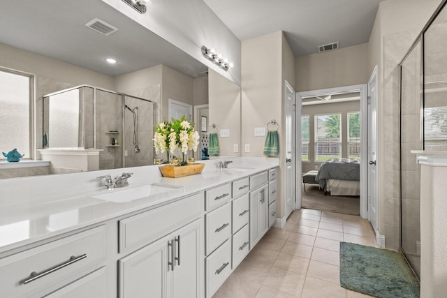 3620 Brahman Ct, Mckinney, TX 75071 - bathroom featuring tile patterned floors, double vanity, ensuite bathroom, and a stall shower