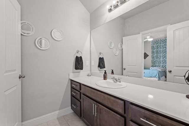 3620 Brahman Ct, Mckinney, TX 75071 - bathroom featuring vanity, tile patterned flooring, connected bathroom, and baseboards