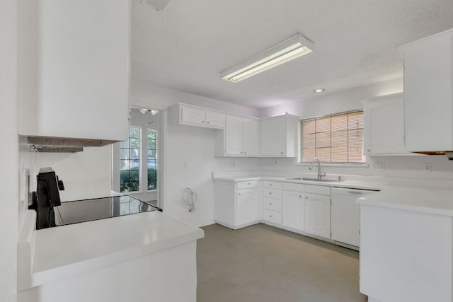 225 Wildwood Dr, Desoto, TX 75115 - kitchen featuring white dishwasher, a sink, white cabinetry, and range