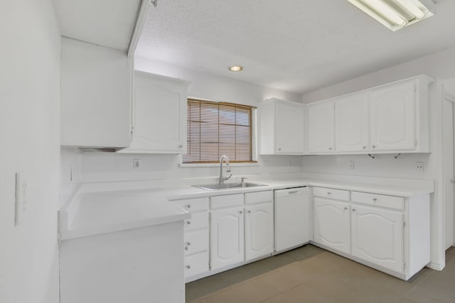 225 Wildwood Dr, Desoto, TX 75115 - kitchen with white dishwasher, a sink, white cabinets, and light countertops