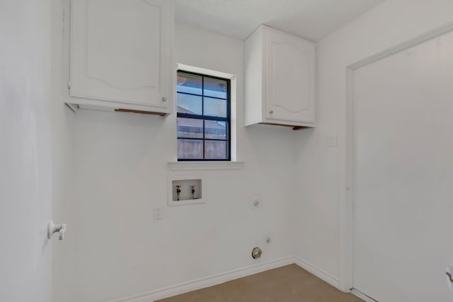 225 Wildwood Dr, Desoto, TX 75115 - washroom featuring electric dryer hookup, hookup for a washing machine, cabinet space, baseboards, and a textured ceiling