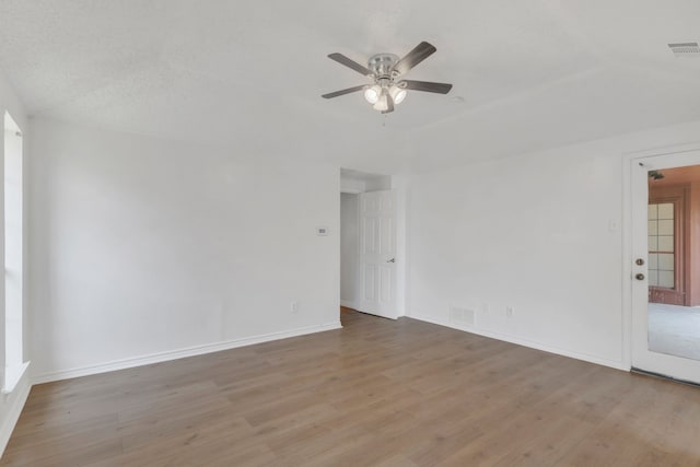 225 Wildwood Dr, Desoto, TX 75115 - spare room with ceiling fan, wood finished floors, and baseboards