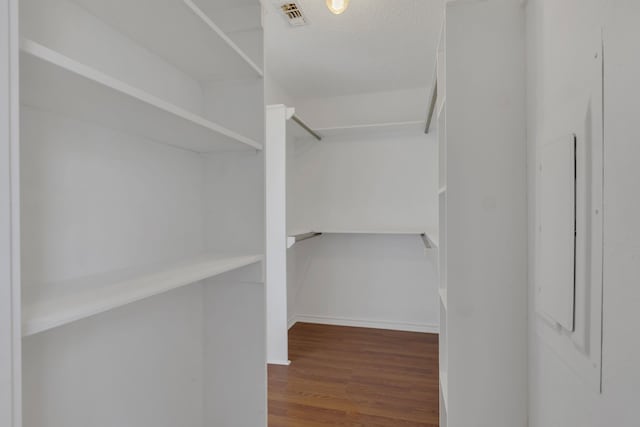 225 Wildwood Dr, Desoto, TX 75115 - walk in closet featuring wood finished floors