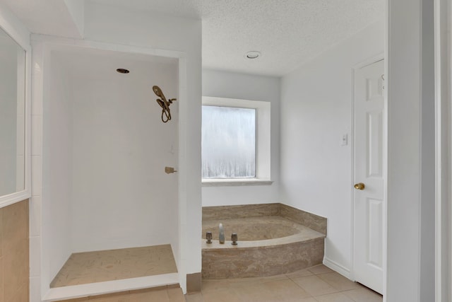 225 Wildwood Dr, Desoto, TX 75115 - full bath featuring a garden tub, tiled shower, tile patterned flooring, and a textured ceiling