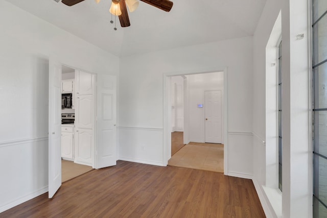 225 Wildwood Dr, Desoto, TX 75115 - empty room featuring ceiling fan, wood finished floors, and baseboards