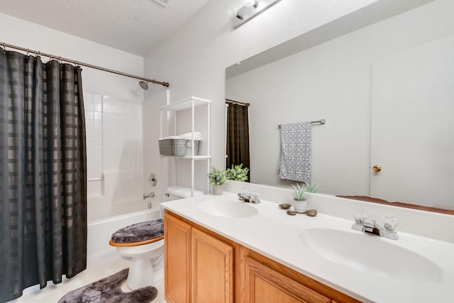 1516 Englewood Dr, Rockwall, TX 75032 - full bathroom with toilet, shower / bath combo with shower curtain, double vanity, a textured ceiling, and tile patterned floors