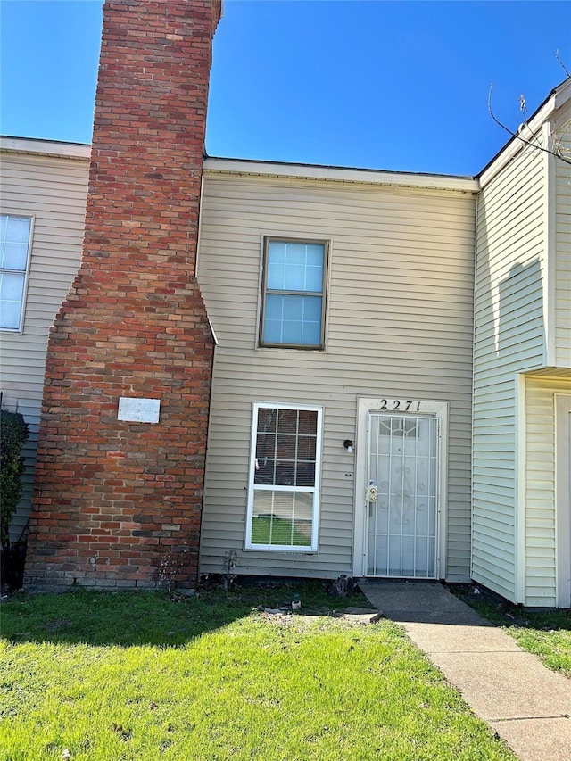2196 Aspen St, Dallas, TX 75227 - property entrance with a chimney and a lawn