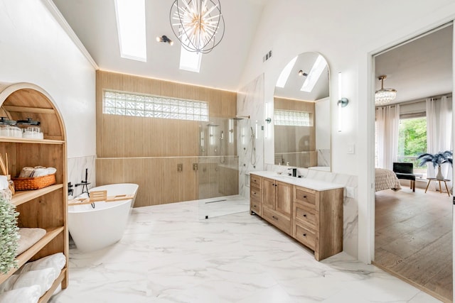 1495 Bent Trail Cir, Southlake, TX 76092 - full bath with vanity, walk in shower, a soaking tub, high vaulted ceiling, and a skylight