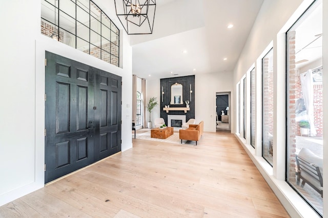 1495 Bent Trail Cir, Southlake, TX 76092 - foyer featuring a towering ceiling, healthy amount of natural light, hardwood / wood-style flooring, a chandelier, and recessed lighting