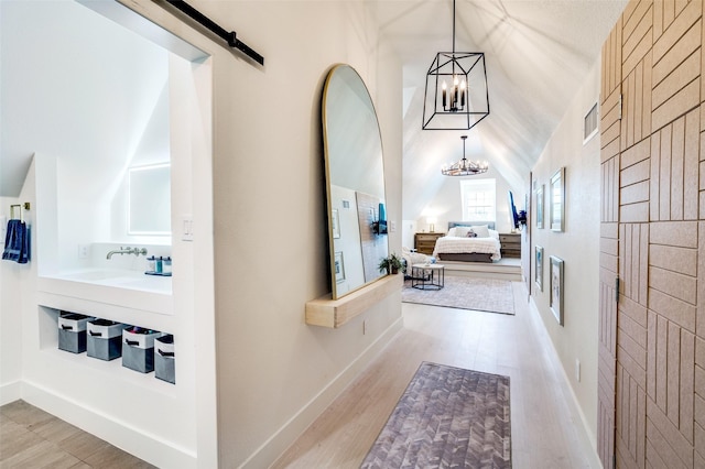 1495 Bent Trail Cir, Southlake, TX 76092 - hall featuring a chandelier, light wood-type flooring, and lofted ceiling