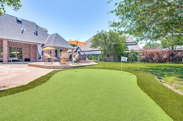1495 Bent Trail Cir, Southlake, TX 76092 - view of yard with a putting area, a patio area, and a swimming pool