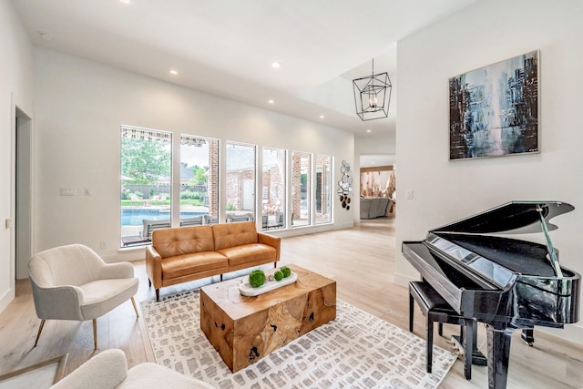 1495 Bent Trail Cir, Southlake, TX 76092 - living room with recessed lighting, a chandelier, light wood-style flooring, baseboards, and a high ceiling