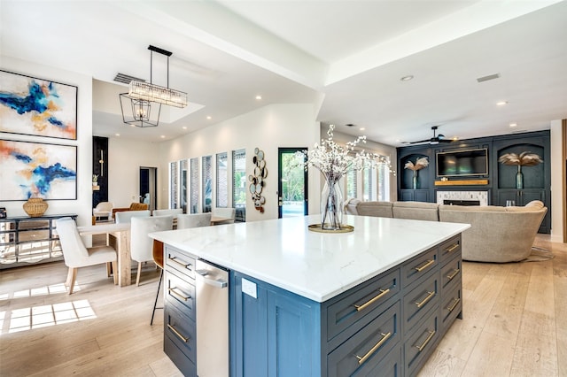 1495 Bent Trail Cir, Southlake, TX 76092 - kitchen featuring open floor plan, light wood-type flooring, recessed lighting, a kitchen island, and hanging light fixtures