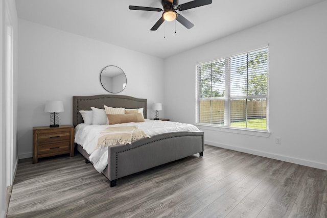 14815 Goliad Dr, Log Cabin, TX 75148 - bedroom with wood finished floors, baseboards, and a ceiling fan