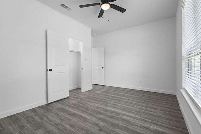 14815 Goliad Dr, Log Cabin, TX 75148 - unfurnished bedroom with dark wood finished floors, baseboards, a ceiling fan, and a closet